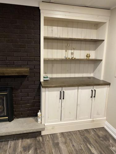 After - Fireplace with custom shelves (right)