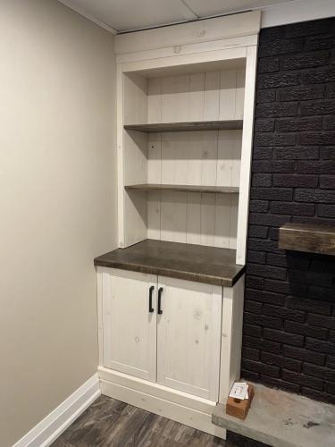 After - Fireplace with custom shelves (left)