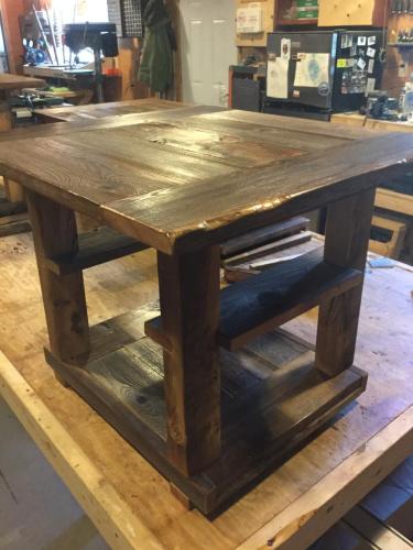 Side table with small side shelves built in for display